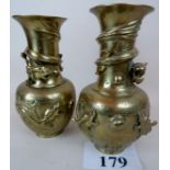 A pair of modern Chinese brass vases, cast in relief with dragons,