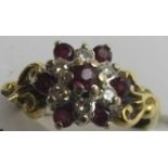 An 18ct gold ruby and diamond cluster ring,