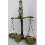 A fine set of brass balance scales with serpent finial,
