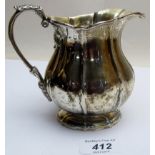 A Victorian Irish silver jug with acanthus leaf handle, Dublin 1824,