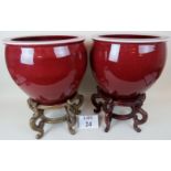A pair of Chinese porcelain Sang de Boeuf glazed jardiniere's, some signs of wear and age,