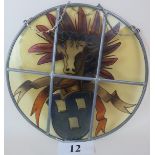 A Victorian hanging stained glass panel, circular, decorated with emblem,