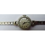 A ladies 9ct white gold diamond set vintage Tudor Royal wristwatch,