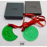 Two Lalique green glass Christmas decorations, one decorated with mistletoe 'Noel 1990',