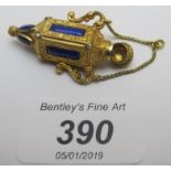 A miniature gilded scent bottle with blue enamel panel and seed pearls est: £200-£300