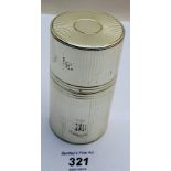 A wooden lined cylindrical white metal box,