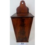 A Georgian mahogany candle box, wall hanging,