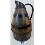 An antique French Normandy iron-bound fruit-wood cider pitcher,
