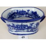 A reproduction Victorian-style blue and white twin-handled ceramic foot bath,