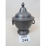 Pewter vase with pedestal base and twin hoop handle, cover with spherical finial,