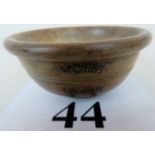 A 19th century turned fruit-wood bowl stamped 'W.