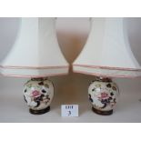 A pair of modern table lamps and shades, the bases being Masons-type ginger jars,