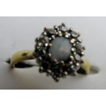 An 18ct gold diamond and opal cluster ring est: £150-£200
