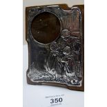 Embossed silver frame depicting mother and children,