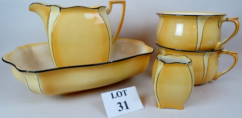 A 1920's/30's Grimwades Royal Winton yellow glazed 5 piece toilet set, comprising a jug, basin,