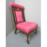 An Edwardian inlaid mahogany framed nursing chair upholstered in pink est: £40-£60