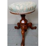 A Victorian carved walnut height adjustable stool,