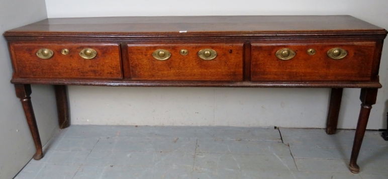 A Georgian oak sideboard with three deep drawers, each having brass handles and lock escutcheons, - Image 2 of 2