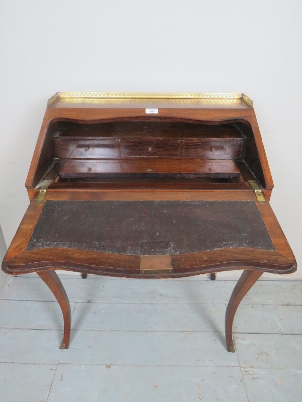 A fine 19th century French walnut bonheur du jour with a pierced brass gallery rail over a - Image 2 of 2