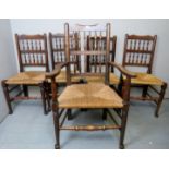 A set of five 19th century oak framed rush seated dining chairs,