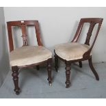 A pair of Victorian mahogany framed chairs, with carved central back columns,