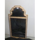 A two sectioned gilt framed wall mirror,