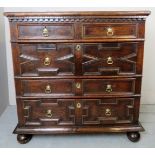 A fine 17th century oak geometric chest of two short over three long drawers,