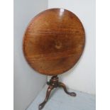 A 19th century oak tilt top wine table,