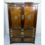 A 20th century Chinese cabinet with double doors to top over two smaller cupboard doors and having