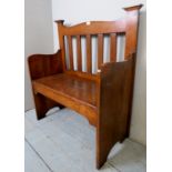 A small carved oak settle,