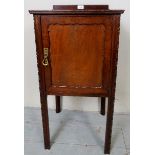 A 20th century mahogany bedside/pot cupboard, with a raised gallery rail to back,