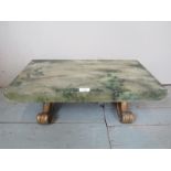 A decorative hand painted solid concrete stool/low table depicting ladybirds amongst foliage and
