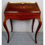 A fine 19th century French walnut bonheur du jour with a pierced brass gallery rail over a