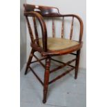 A 19th century turned oak captain's desk chair,