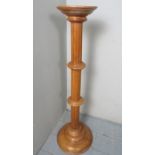 A 20th century pale mahogany reed torchere stand est: £30-£50