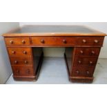 A Victorian mahogany pedestal desk, with a dark green tooled inset leather,