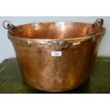 A fantastic hammered copper pan/log bin, with iron ring handles, of good rich colour,