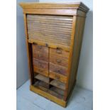 A 20th century light oak tambour filing cabinet,