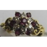An 18ct gold ruby and diamond cluster ri
