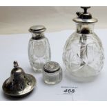 A silver top scent bottle, engraved with