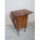 A C.1920 figured walnut bedside cabinet