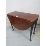 A Georgian mahogany pad foot drop leaf d