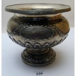 A heavy embossed pedestal bowl, marked 9