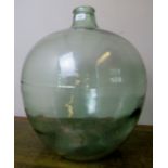 A vintage glass carboy/demijohn, slightl