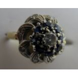 An 18ct gold sapphire and diamond cluste