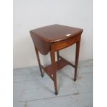 An Edwardian drop leaf side table with a