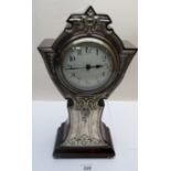 A silver fronted mantel clock approx 12"