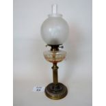 A Victorian brass 'fluted column', oil lamp, with faceted glass reservoir, chimney and shade,