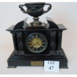 An ornate Victorian marble and bronzed metal cased chiming mantel clock of Romanesque architectural