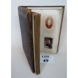 A Victorian photograph album containing Victorian portrait photographs est: £20-£40